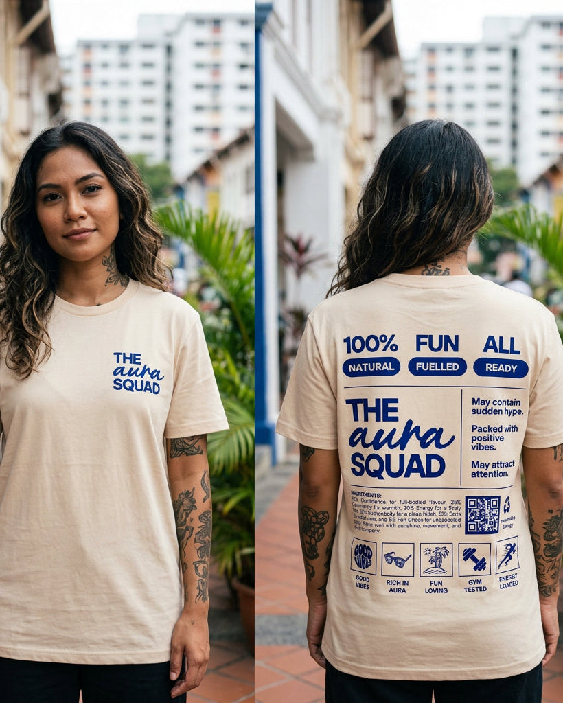 Person wearing a beige t-shirt with 'The Alpha Squad' text and graphics on both front and back, outdoors.