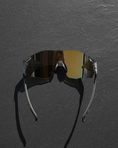 Sunglasses with reflective lenses on a dark gray background