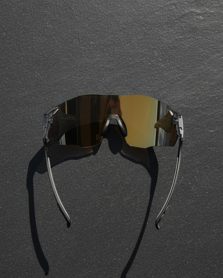 Sunglasses with reflective lenses on a dark gray background