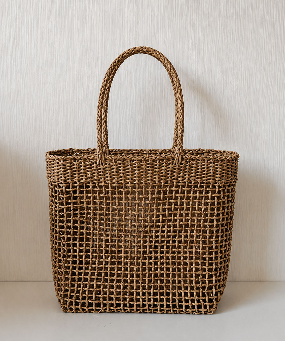 The Carryall Bag handwoven beach tote in natural recycled paper fibre, front view
