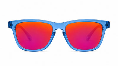 Blue translucent sunglasses with mirrored red-to-pink gradient lenses, shown from the front on a white background.