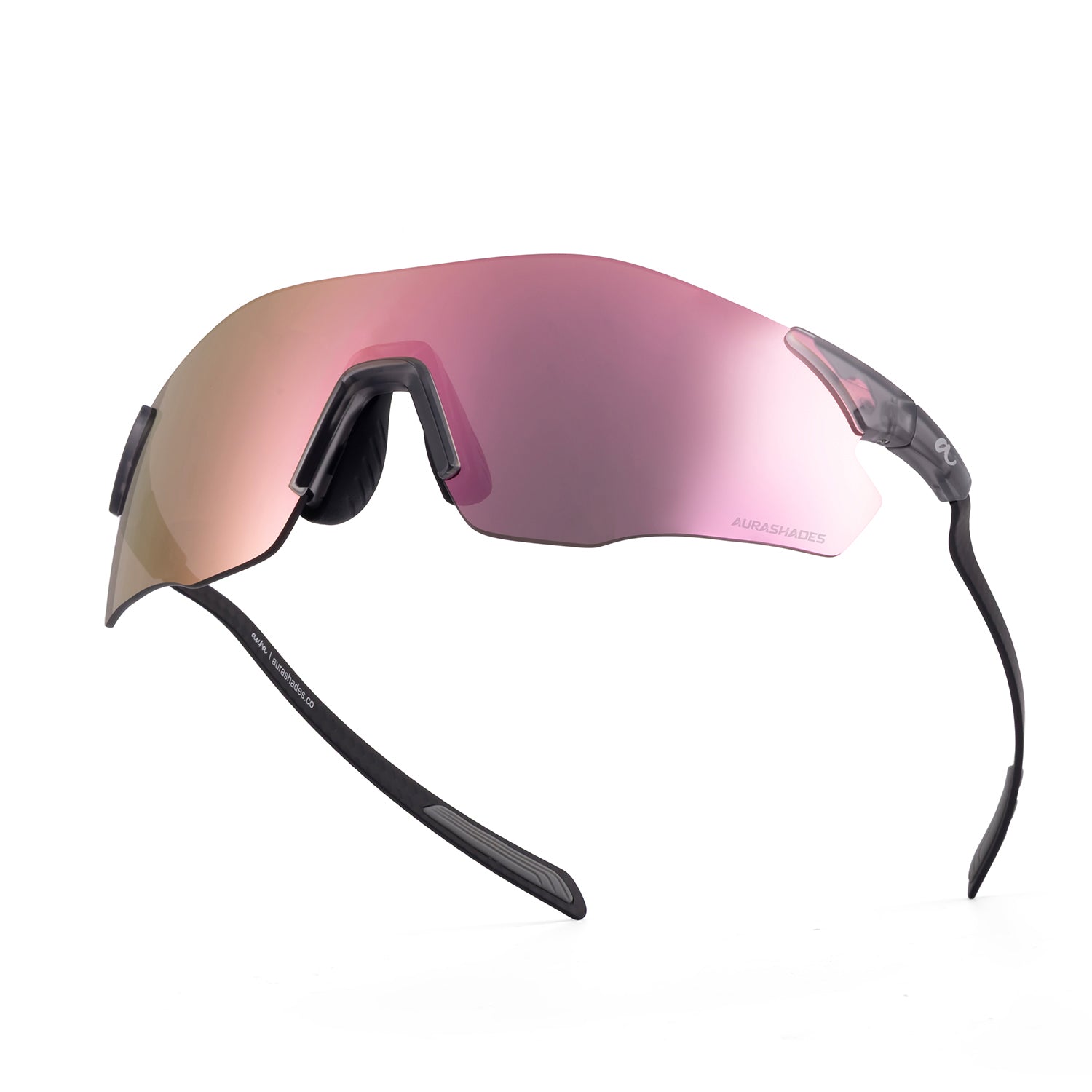 A pair of shield-style sunglasses with a large mirrored pink-to-gold gradient lens and black arms, photographed on a clean white background.