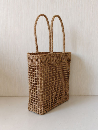 Natural open-weave texture and long shoulder handles on The Carryall Bag